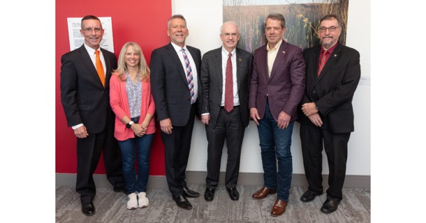 (Pictured Left to Right:  DHHS CEO Steve Corsi; Becky Gilbert, Manager of the Monroe-Meyer IT team;  Steve Green, Deveopmental Disabilities Director for DHHS; UNMC Chancellor Jeffrey Gold; Gov. Jim Pillen; Dr. Karoly Mirnics, director of the Monroe-Meyer Institute)